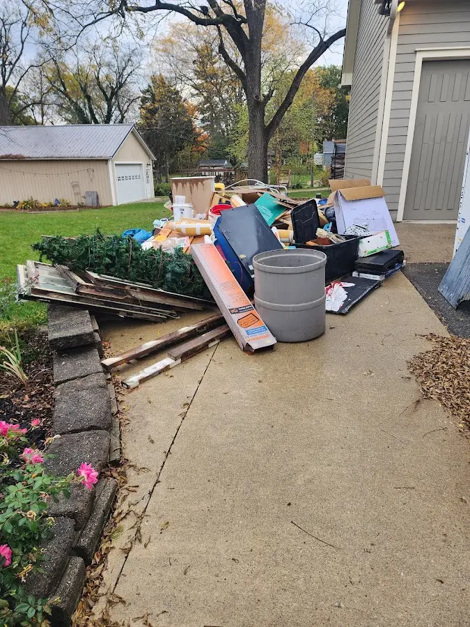 Dumpster being loaded with debris for 30 Yard Dumpster Rental in Chenango